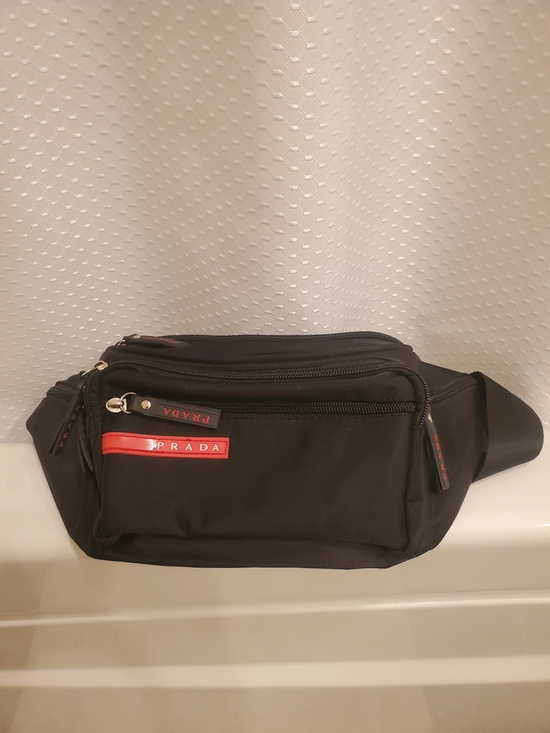 Prada Handbags - Prada Black Nylon Belt Bag with Red Logo Trim
